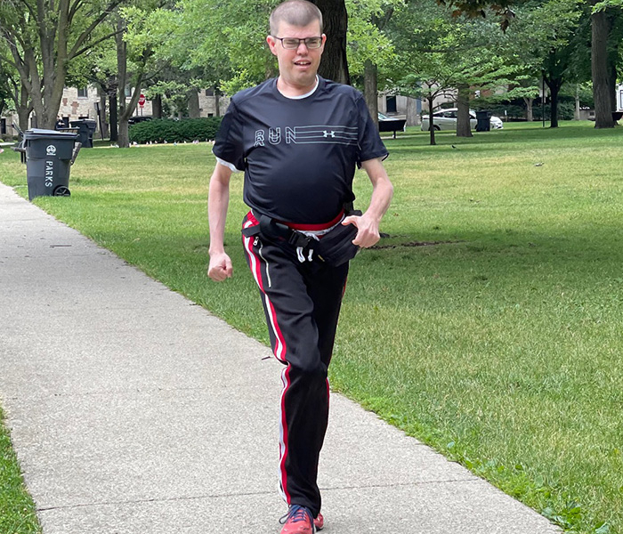 Man jogging on sidewalk